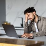 Image of frustrated person maintaining a website